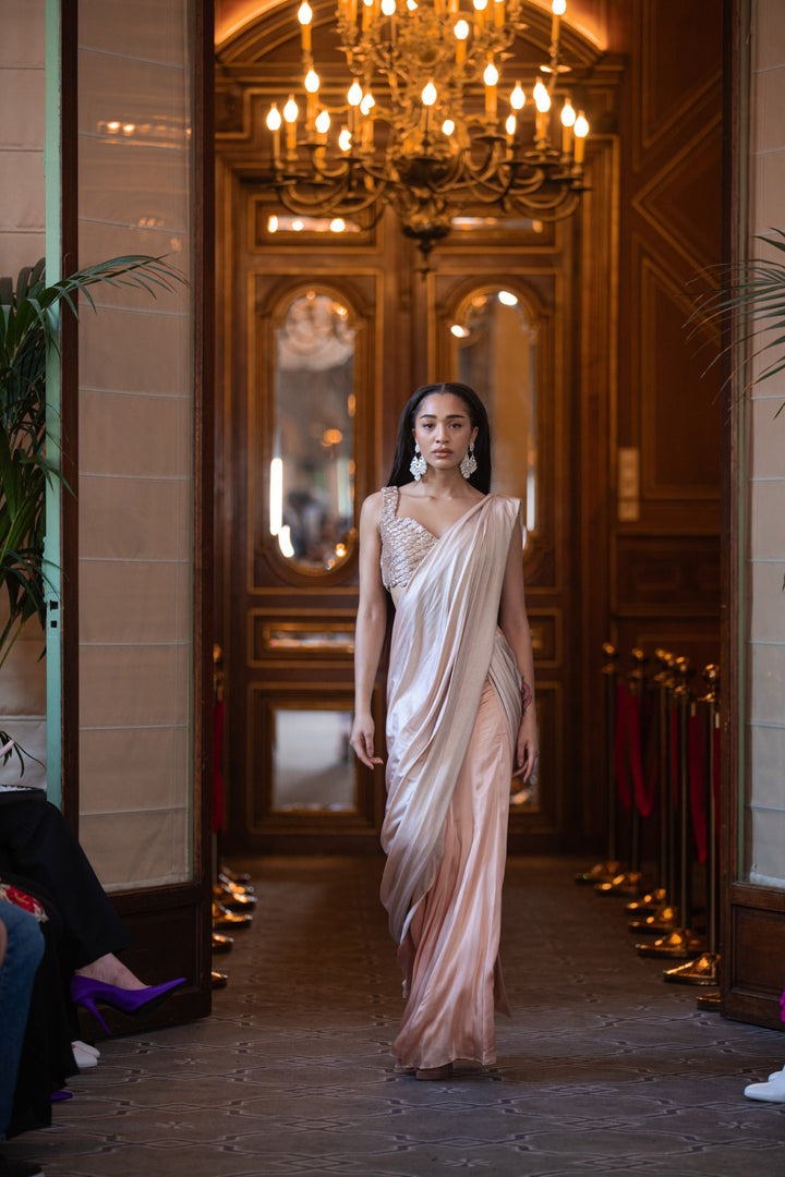 Nude coloured pre-stitched saree with embroidered blouse