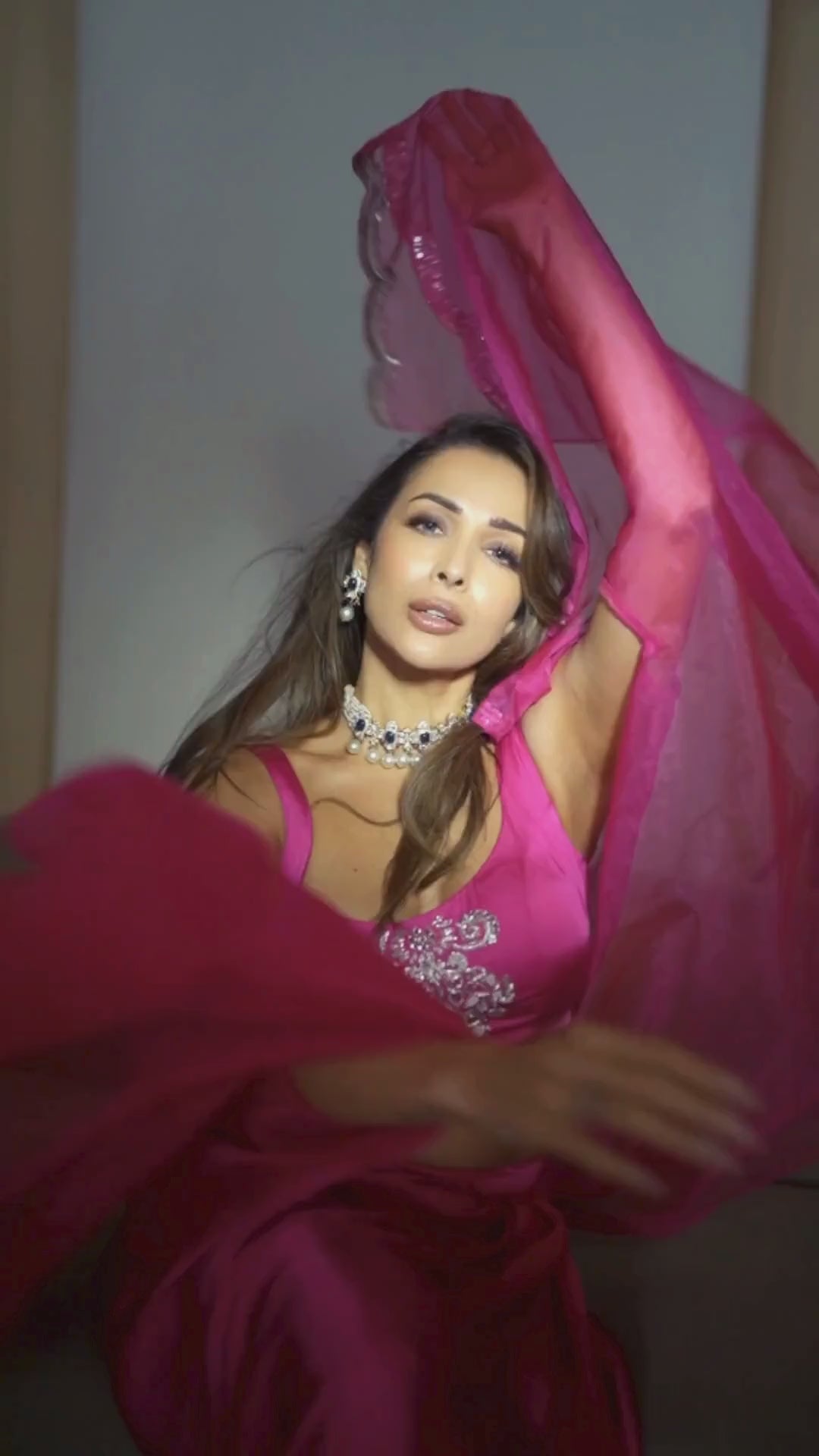 Malaika Arora in Hot Pink Draped Skirt with Bustier and Cape